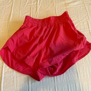 Bright Pink Lululemon track that shorts 3in.